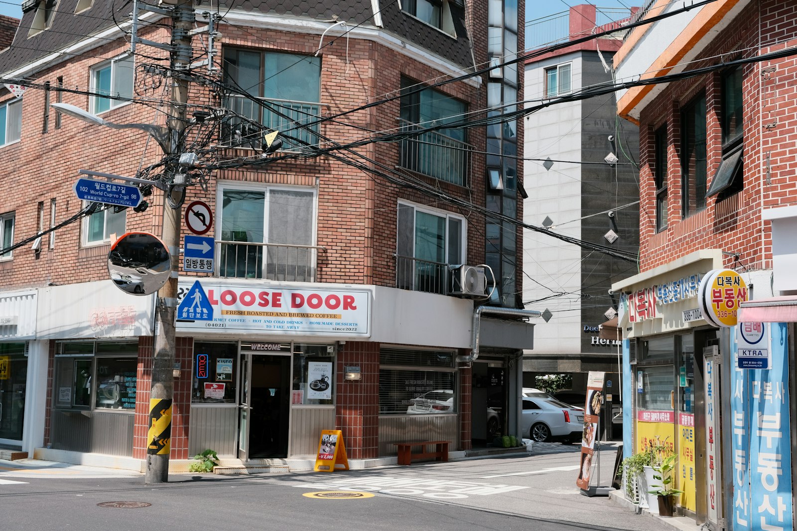 A small coffee shop storefront on a city street corner
